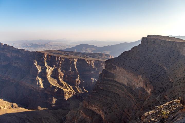 Layered cliffs of the Wadi Ghul canyon below Jebel Shams