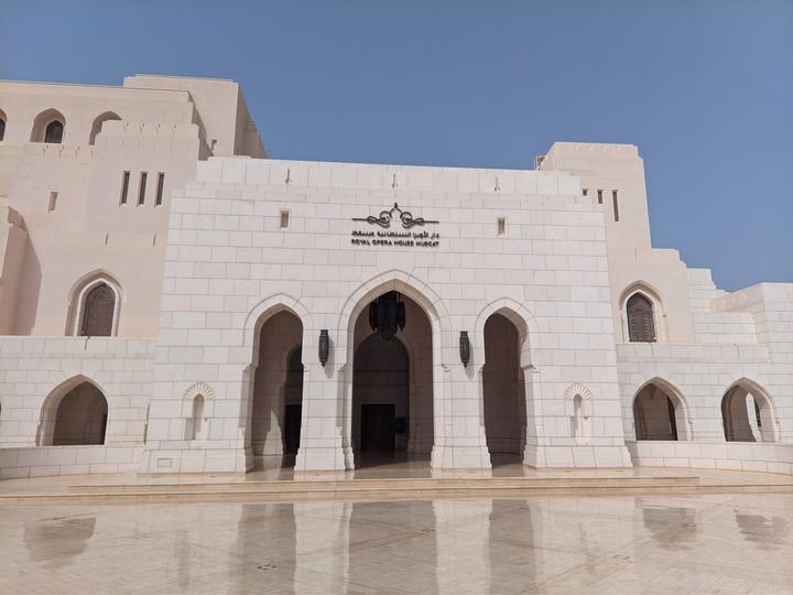 Arched stone entrance of the Royal Opera House Muscat