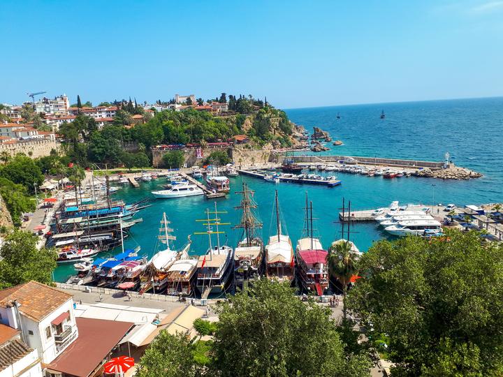 The old harbour of Kaleiçi in Antalya with wooden boats and turquoise water