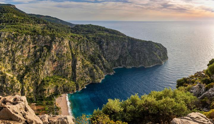 Butterfly Valley beach between high cliffs near Fethiye, seen from above
