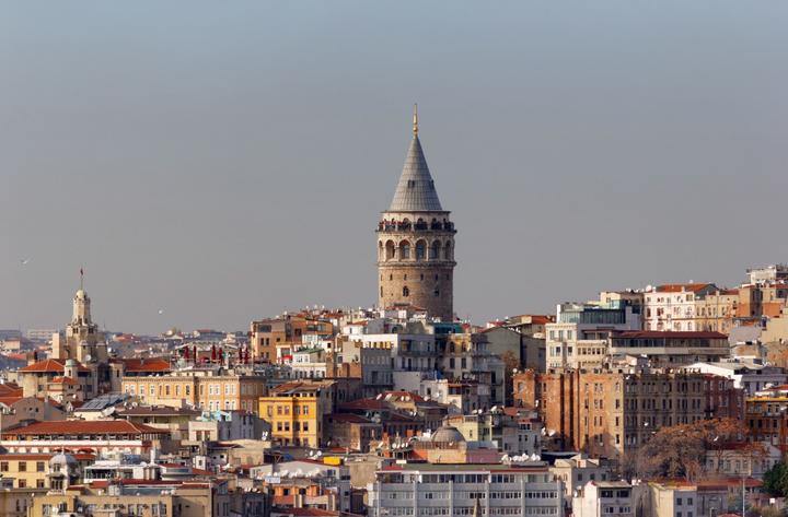 The conical roof of Galata Tower rising above the rooftops of Beyoğlu, Istanbul