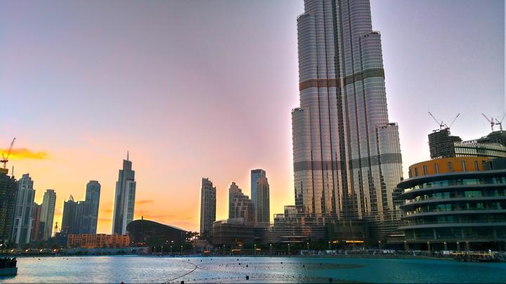 Burj Khalifa and the fountain lake at sunset